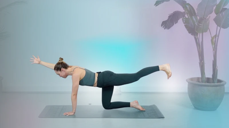 Woman doing balancing pregnancy yoga pose