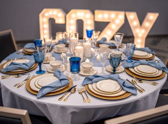 Wedding reception with vintage China rental settings.