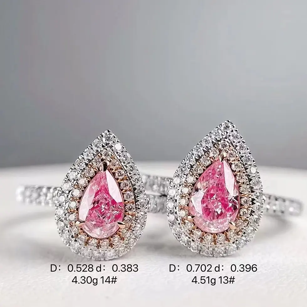 Thumbnail: Two pear-shaped pink diamonds: D: 0.528, 0.383, 4.30g 14# and D: 0.702, 0.396, 4.51g 13#