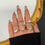Thumbnail: Hand model wearing seven rings