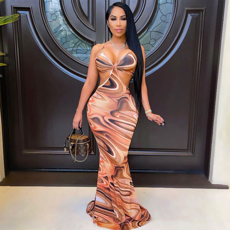 Thumbnail: Woman in brown printed maxi dress