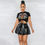 Miniature : Woman in black top and leather skirt