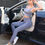 Thumbnail: Woman in gray yoga outfit sitting in a car