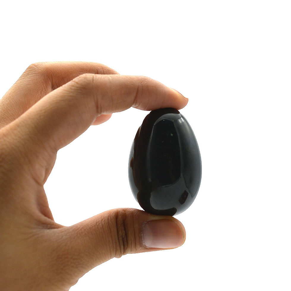 Thumbnail: Hand holding black obsidian yoni egg
