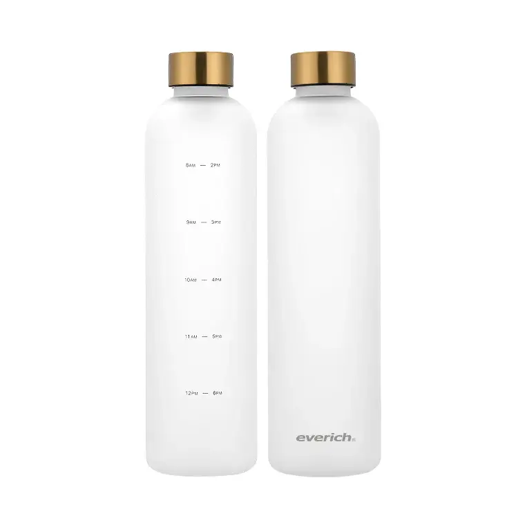 Two white Energic water bottles with gold lids