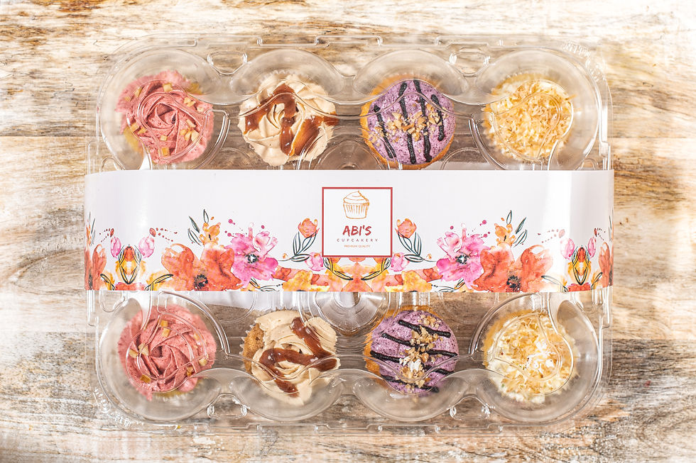 Thumbnail: Assorted cupcakes in Abi's Cupcakery box