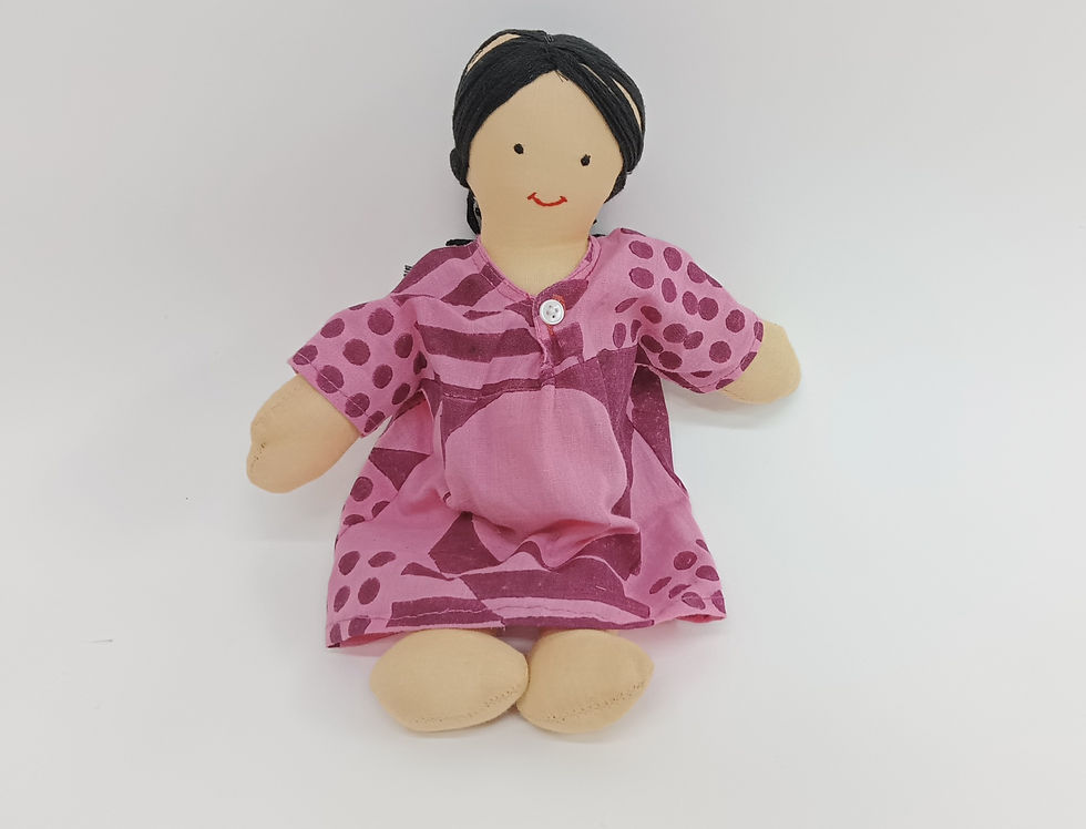 Soft toy expectant mum doll wearing a pink and red dress and cotton hair in a plait