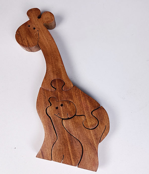 Small four piece jigsaw puzzle of a giraffe and baby giraffe