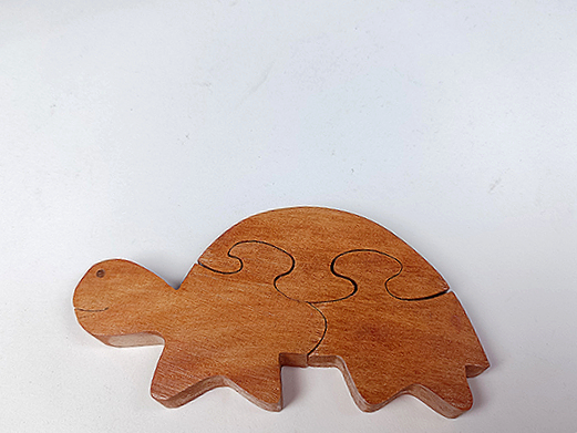 Small wooden 3-piece jigsaw puzzle of a tortoise