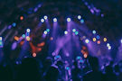 This vibrant image showcases an abstract view of a lively event or concert, with a beautif