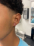 tiny titanium man lobe piercing in tampa