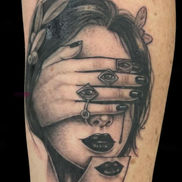 Black and grey surreal portrait tattoo with three eyes by Laetitia Coleman.