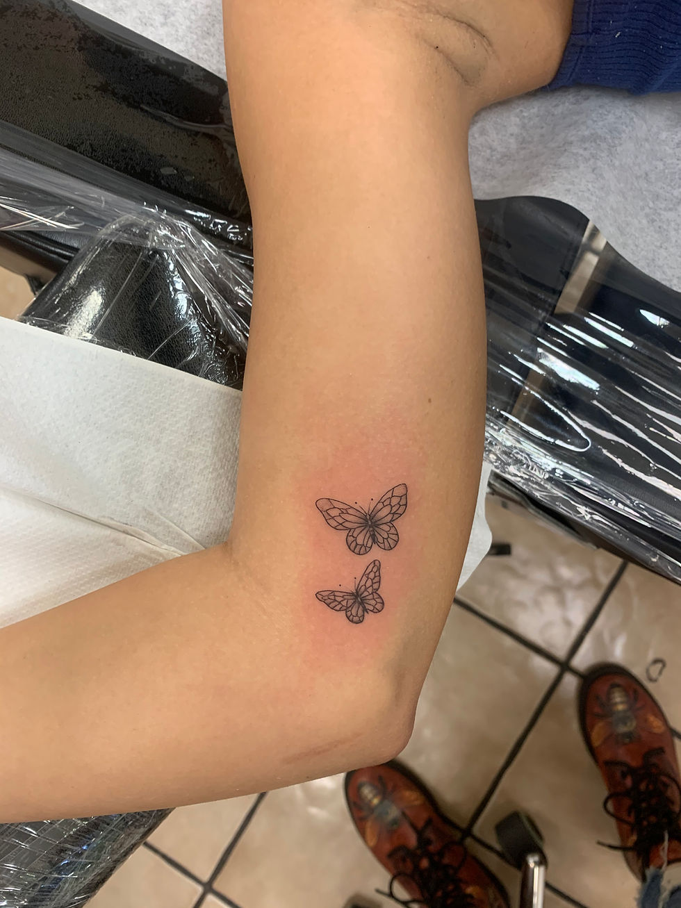 Fine line butterfly tattoo delicate Tampa