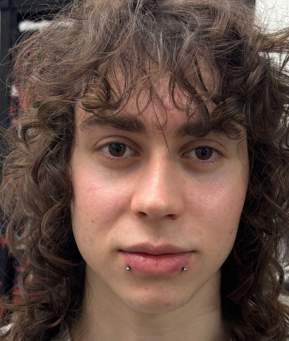 snake bites lip piercing using long titanium bars for initial healing at Angel Tattoo Tampa.