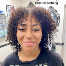 Gold septum piercing by Ryan in Tampa