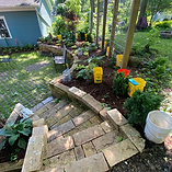 Natural stone hardscaping project featuring a retaining wall and stone steps in Dane County, WI by 4 Corners Hardscapes