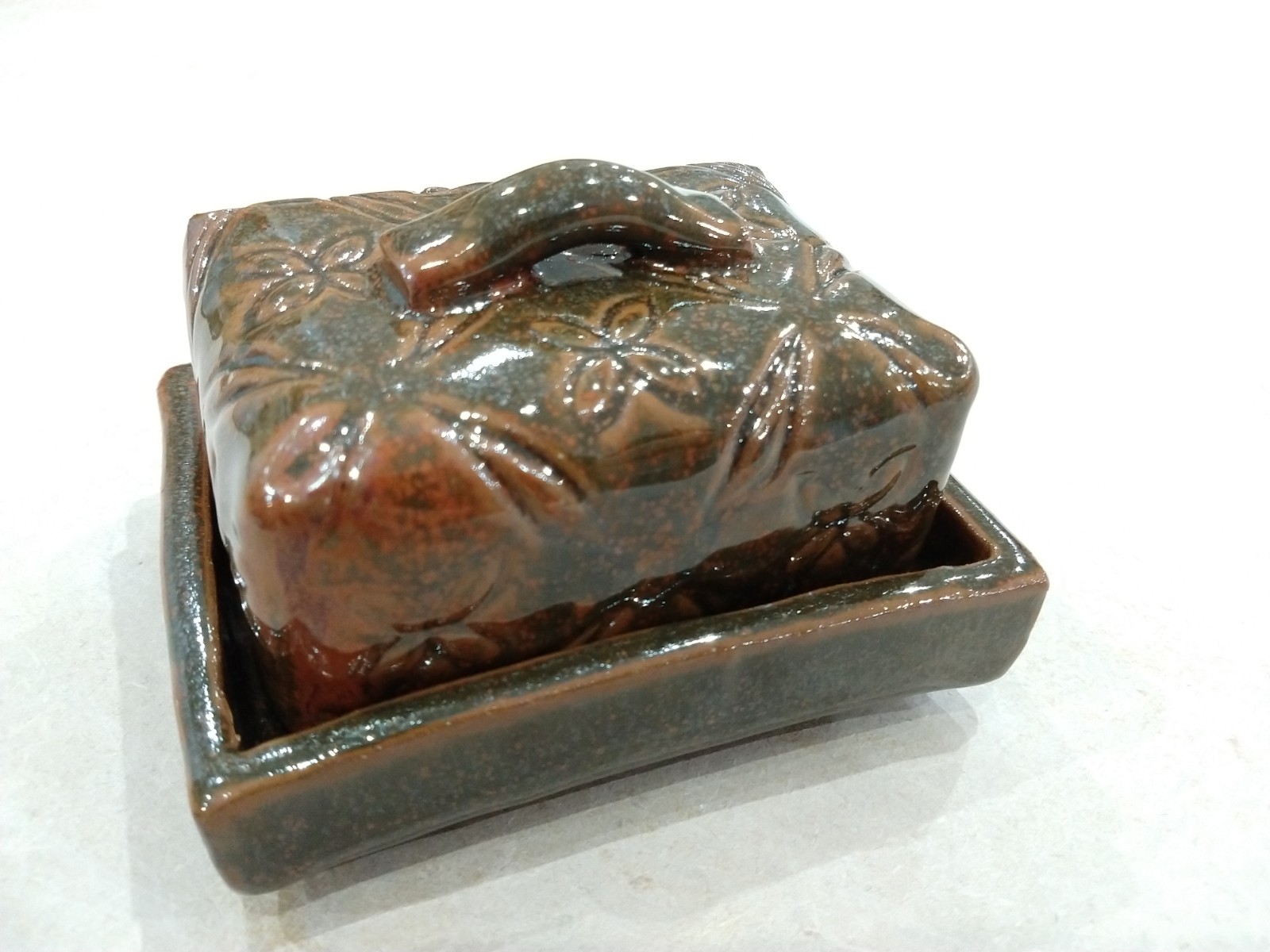 Butter dish with orange brown glaze