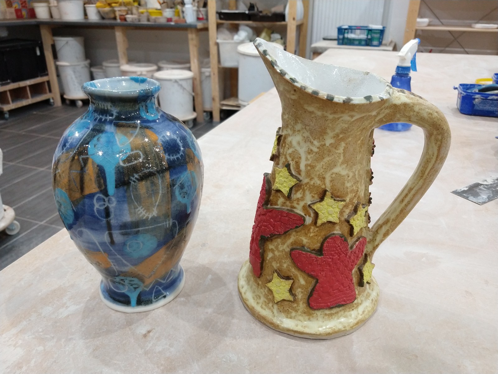 Slip decorated vase and hand built jug