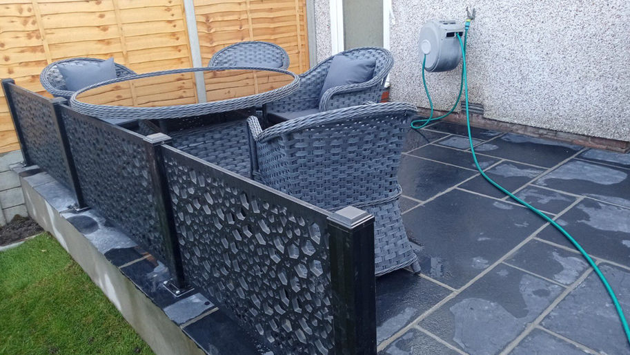 Finished small black granite paving area with composite railings completed in Patchway Bristol by Ivanhomes builders