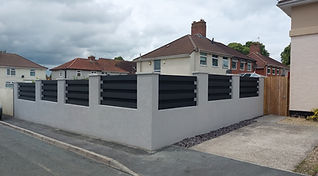 Exterior view of Ivanhomes Modern Boundary wall with black fence in Bristol