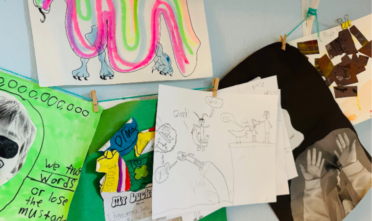 Kids' artwork hanging up on display to celebrate a child's creative spirit.