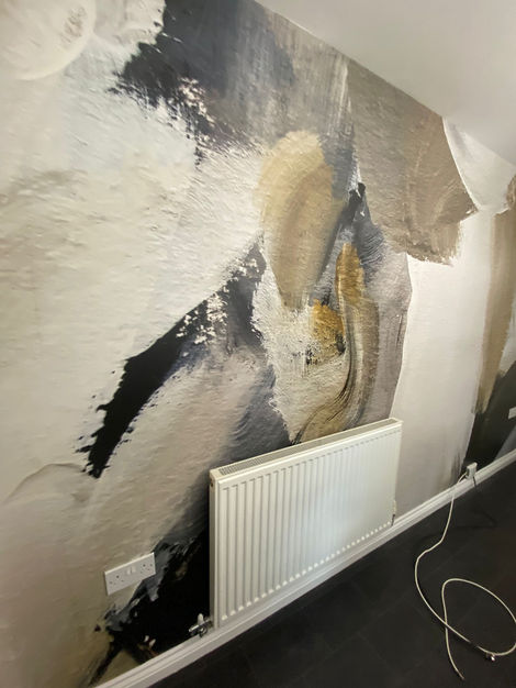 This eye-catching abstract mural transforms the space into a modern statement room. Featuring bold strokes of gold, charcoal, and white on a textured wall, the design is dynamic and expressive—an example of how expert decorating can bring artistic energy into a home.
-
Thanks to Our Client.
It was great project to be part of by leaving our signature on it.
Please support us on our socials @jdcltd.info