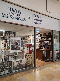 A picture of the entrance to the exhibition, "Away for the Messages" which is part of The Wee Museum of Memory