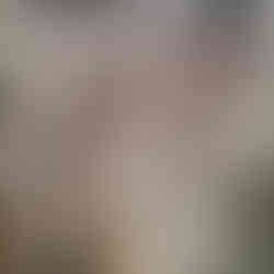 Industrial ship engine room with large white pipes, gauges, and machinery. Metal surfaces and red cylinders are visible. Bright lighting.