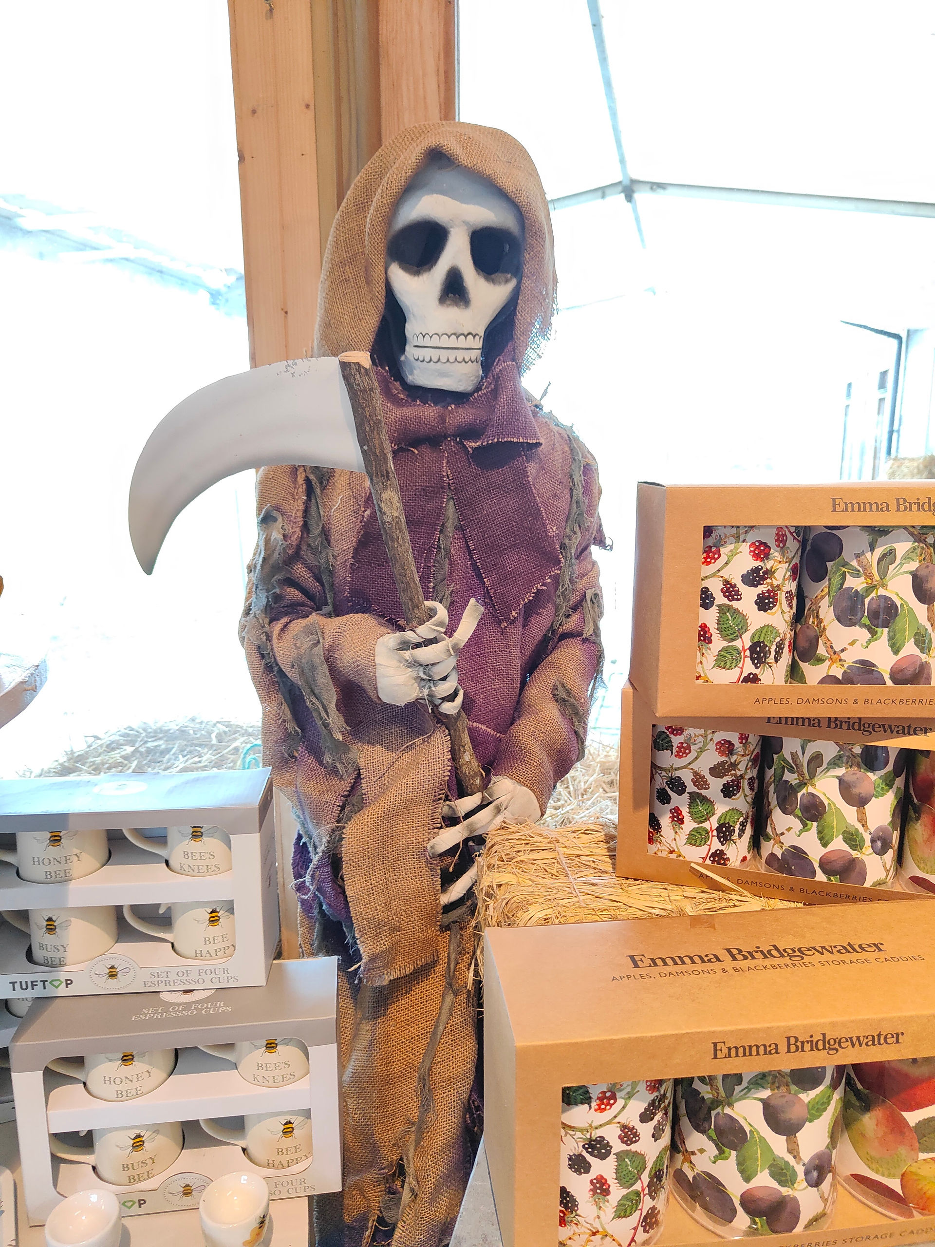 A life-sized skeleton grim reaper decoration.