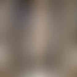 Vintage audio equipment with reel-to-reel tape, controls, and display case. Neutral tones and detailed text description below.