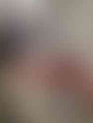 Table with festive treats and Christmas packaging displayed for sale. A sign reads "Ann Crafted: Handmade Cards & Cushions."