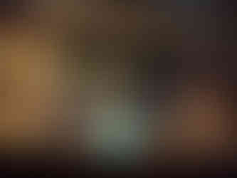 A 3D projection of a fox leaping above a glowing blue flame, surrounded by sparkling particles.