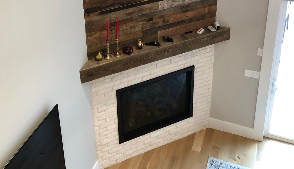 reclaimed wood accent wall and barn beam mantel