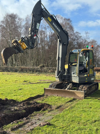 Excavating field drains