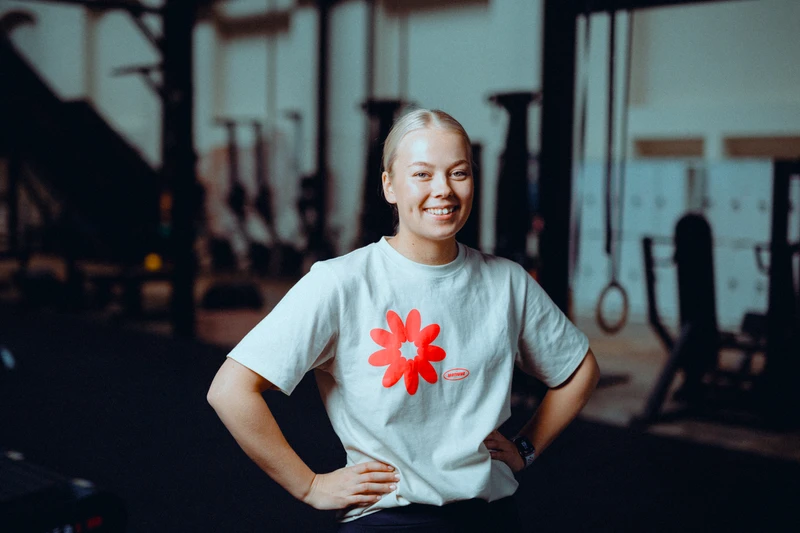 Coach smiling at the gym