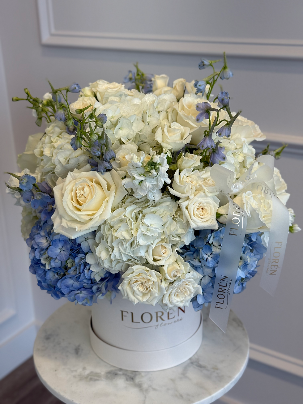 Thumbnail: Box arrangement “Sky Serenade”- hydrangeas, delphinium, roses, stock flowers