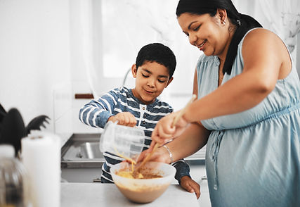 boy-helps-woman-prepare-food-in-kitchen-2026-01-09-09-44-37-utc.jpg