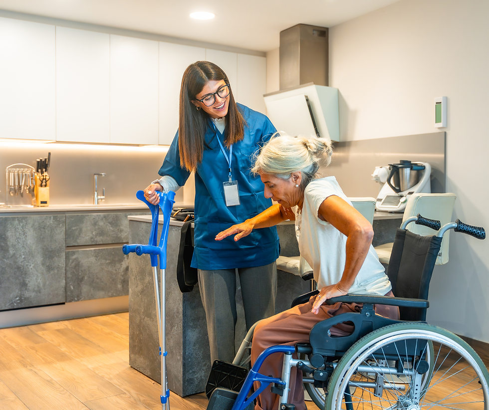 Caregiver assisting elderly woman from wheelchair, crutches nearby. Personal Care with Loving Hands