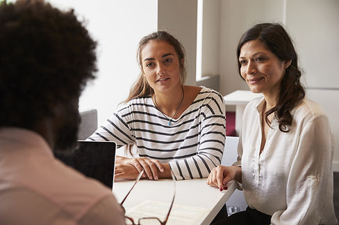 Mother And Daughter Meeting With Male Teacher.jpg