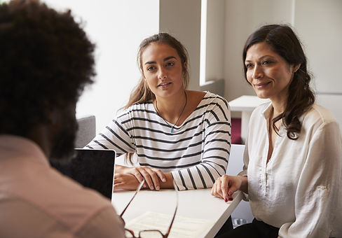 Mother And Daughter Meeting With Male Teacher.jpg