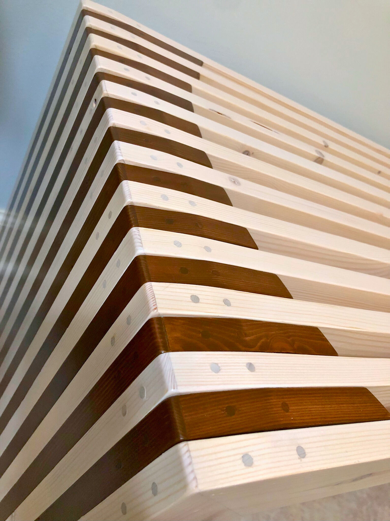 Scandinavian design with alternating white and brown finish close up of end design