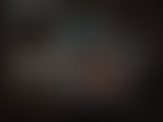 Warehouse worker wearing an orange vest holding their back in pain. Text overlay reads: 'Workplace Injury Treatment in Vancouver: Recover Safely and Return Stronger with ĀLow Mobile Physio.'