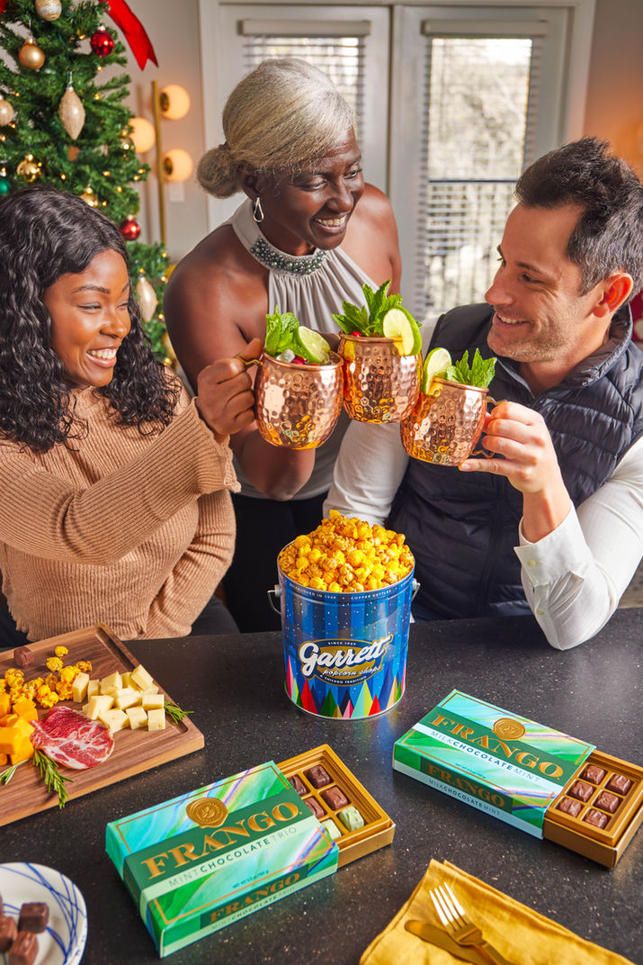 Lifestyle shot friends sharing Garrett Popcorn at gathering commercial lifestyle photography Crawford Captures Chicago