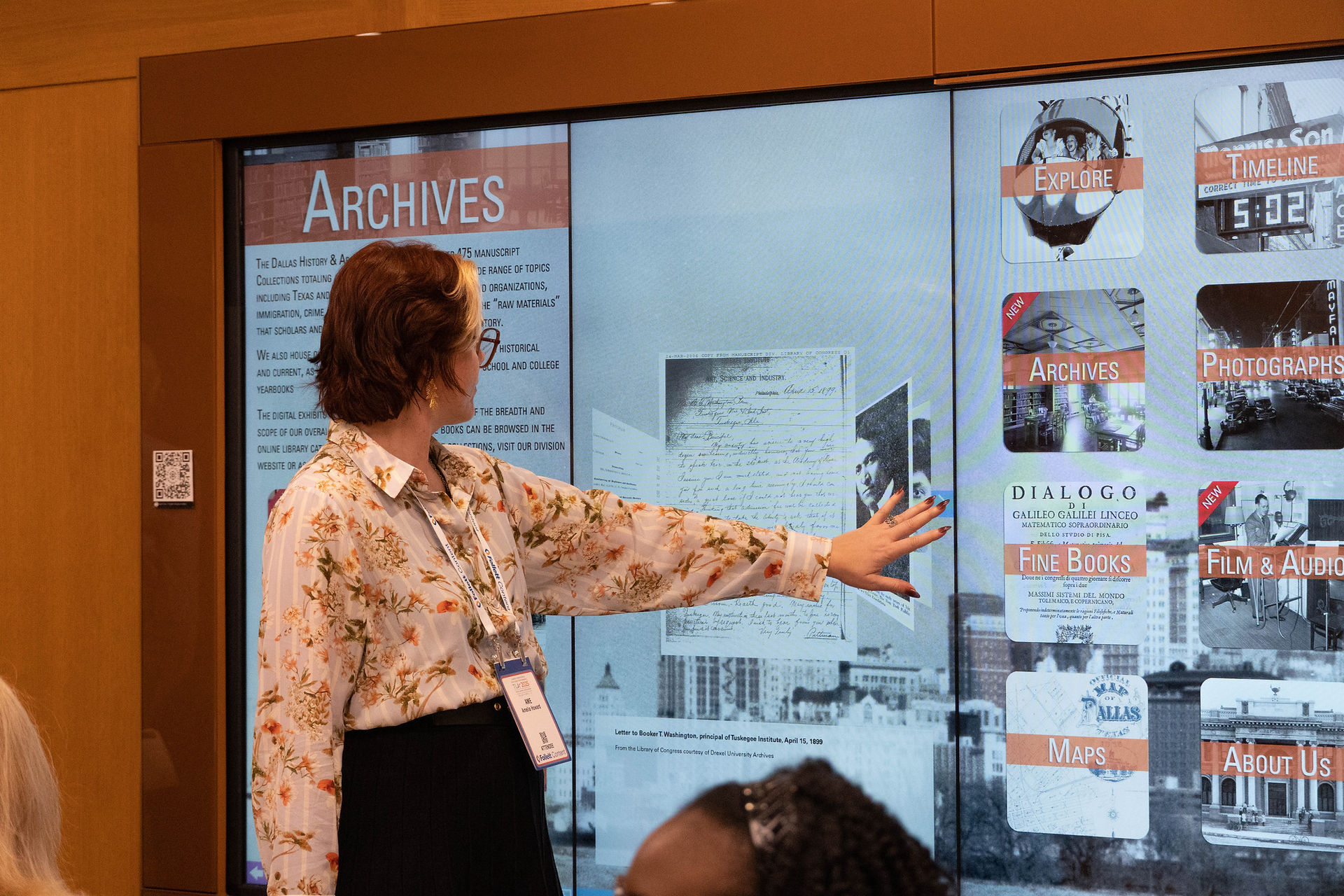 Woman explores the Digital Interactive Gallery