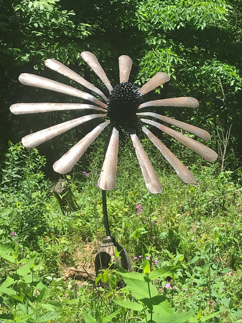 The Coneflower. 
Made from a large argon welding tank. The top of the tank becomes the base, The cone is made from the tank cap and the petals are made from the sides of the tank.
Available and For Sale by order. 

