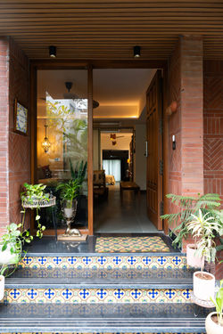 Thoughtfully designed home where exposed brick and patterned tiles create a timeless aesthetic.