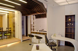 Raised platforms with wooden curved ceilings and a coffee bar for a dream office space