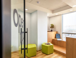 Designed around fluid collaboration, the workspace combines rounded meeting pods with bold architect