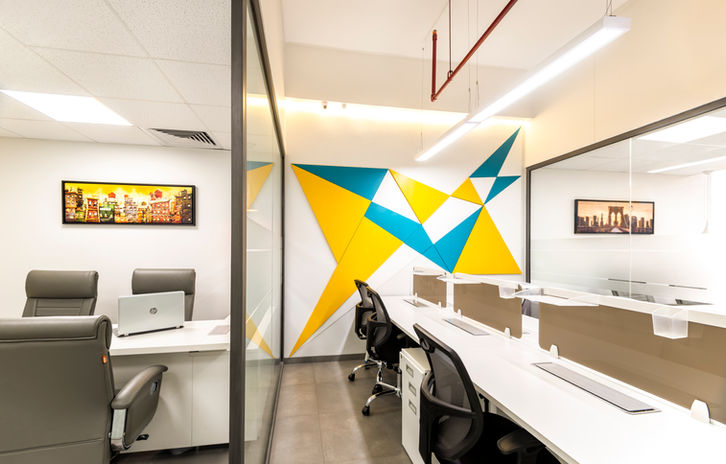 Abstract wall art in bold colors adorn the wall of NCPL office 