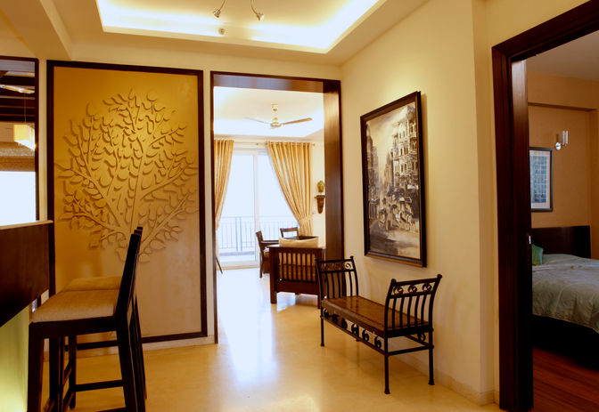 Modern apartment design in Emaar Palm Springs, Gurgaon with tree of life as a feature